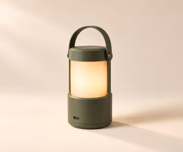 Olive Trail Lantern with a carry handle and warm light